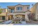 Two-story house with balcony and landscaped front yard at 9103 Mcginnis Ave, Las Vegas, NV 89148