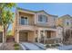 Two story home with attached garage and front patio at 9103 Mcginnis Ave, Las Vegas, NV 89148