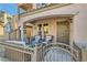 Inviting front porch with seating area and wrought iron fence at 9103 Mcginnis Ave, Las Vegas, NV 89148