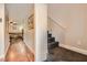 Hallway with wood floors leading to living room and stairs at 9103 Mcginnis Ave, Las Vegas, NV 89148