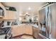 Modern kitchen with stainless steel appliances and light wood cabinets at 9103 Mcginnis Ave, Las Vegas, NV 89148