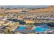 Community pool and surrounding landscape from above at 928 Calluna Hills Ln, Las Vegas, NV 89138