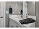 Modern bathroom with white vanity and dark towels at 928 Calluna Hills Ln, Las Vegas, NV 89138