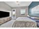 Spacious bedroom with king-size bed and access to balcony at 928 Calluna Hills Ln, Las Vegas, NV 89138