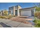 Single-story home with stone accents and a two-car garage at 928 Calluna Hills Ln, Las Vegas, NV 89138