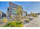 Contemporary home with stone exterior and mature landscaping at 928 Calluna Hills Ln, Las Vegas, NV 89138