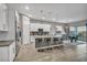 Modern kitchen with white cabinets, stainless steel appliances, and an island at 928 Calluna Hills Ln, Las Vegas, NV 89138