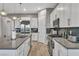 Modern kitchen with white cabinets, stainless steel appliances, and an island at 928 Calluna Hills Ln, Las Vegas, NV 89138