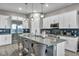 Modern kitchen with white cabinets, stainless steel appliances, and a gray countertop at 928 Calluna Hills Ln, Las Vegas, NV 89138