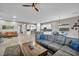 Open concept living room with adjacent kitchen and dining areas at 928 Calluna Hills Ln, Las Vegas, NV 89138