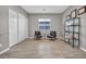 Home office with wood-look floors and two chairs at 928 Calluna Hills Ln, Las Vegas, NV 89138