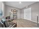 Home office with wood-look floors and two chairs at 928 Calluna Hills Ln, Las Vegas, NV 89138