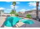 Enjoy this backyard's inground pool and attached spa, perfect for relaxation and entertainment at 9852 Snowy Canyon Ct, Las Vegas, NV 89183