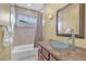 Clean bathroom with shower/tub combo, glass sink, and vanity at 9852 Snowy Canyon Ct, Las Vegas, NV 89183