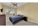 Comfortable bedroom with a ceiling fan and a window providing natural light at 9852 Snowy Canyon Ct, Las Vegas, NV 89183