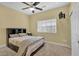 Bedroom with a queen bed, ceiling fan, and TV at 9852 Snowy Canyon Ct, Las Vegas, NV 89183