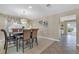 Dining area with large table and chairs, adjacent to kitchen and stairs at 9852 Snowy Canyon Ct, Las Vegas, NV 89183