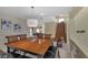 Spacious dining room with a large wooden table and six chairs at 9852 Snowy Canyon Ct, Las Vegas, NV 89183