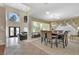 Spacious dining area with a table for six, adjacent to the living room at 9852 Snowy Canyon Ct, Las Vegas, NV 89183