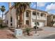 Two-story house with a three-car garage and desert landscaping at 9852 Snowy Canyon Ct, Las Vegas, NV 89183