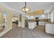 Kitchen with white cabinets, an island, and tile floors at 9852 Snowy Canyon Ct, Las Vegas, NV 89183