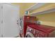 Bright laundry room, featuring a washer and dryer and extra shelving at 9852 Snowy Canyon Ct, Las Vegas, NV 89183