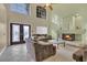 Living room with high ceilings, fireplace and double doors at 9852 Snowy Canyon Ct, Las Vegas, NV 89183