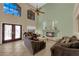 Comfortable living room with fireplace and plenty of natural light from the large windows at 9852 Snowy Canyon Ct, Las Vegas, NV 89183