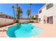 Inviting kidney-shaped pool with waterfall feature in backyard at 9852 Snowy Canyon Ct, Las Vegas, NV 89183