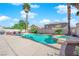 Outdoor pool with a hot tub and palm trees at 9852 Snowy Canyon Ct, Las Vegas, NV 89183