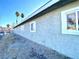 Light gray stucco building with windows and landscaping at 99 N 21St St, Las Vegas, NV 89101