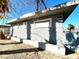 Light gray stucco siding and a landscaped area at 99 N 21St St, Las Vegas, NV 89101