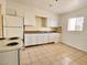 Efficient kitchen featuring white cabinets and tile floors at 99 N 21St St, Las Vegas, NV 89101