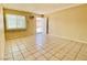 Bright living room with tile floors and an exterior door at 99 N 21St St, Las Vegas, NV 89101