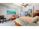 Bright bedroom with king bed, ceiling fan and large artwork at 10093 Golden Bluff Ave, Las Vegas, NV 89148