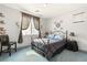 Bedroom with metal frame bed and gray bedding at 10093 Golden Bluff Ave, Las Vegas, NV 89148