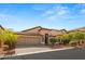 Two-story home with three-car garage and manicured landscaping at 10093 Golden Bluff Ave, Las Vegas, NV 89148