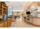 Open kitchen with island and views into the game room at 10093 Golden Bluff Ave, Las Vegas, NV 89148