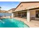 Relaxing pool area with covered patio and comfortable seating at 10093 Golden Bluff Ave, Las Vegas, NV 89148