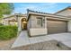 Charming house with a two-car garage and nicely landscaped front yard at 10369 Niagara Falls Ln, Las Vegas, NV 89144