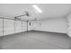 Spacious garage with epoxy flooring and overhead storage at 10369 Niagara Falls Ln, Las Vegas, NV 89144