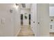 Bright hallway with light wood-look floors and access to bedrooms at 10369 Niagara Falls Ln, Las Vegas, NV 89144