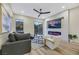 Living room with modern fireplace and sliding glass doors at 10369 Niagara Falls Ln, Las Vegas, NV 89144