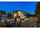 Night view of backyard, fire pit, patio furniture at 108 Breeze Ct, Las Vegas, NV 89145