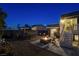 Backyard with fire pit, patio furniture, and stairs at 108 Breeze Ct, Las Vegas, NV 89145