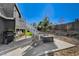 Relaxing backyard patio with fire pit and seating area at 108 Breeze Ct, Las Vegas, NV 89145