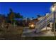 Backyard with fire pit, patio furniture, and stairs at 108 Breeze Ct, Las Vegas, NV 89145