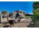 Home's backyard, featuring patio furniture and fire pit at 108 Breeze Ct, Las Vegas, NV 89145