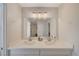 Double vanity with modern light fixtures in updated bathroom at 108 Breeze Ct, Las Vegas, NV 89145