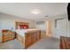 Bright bedroom with wood platform bed and ensuite bathroom access at 108 Breeze Ct, Las Vegas, NV 89145